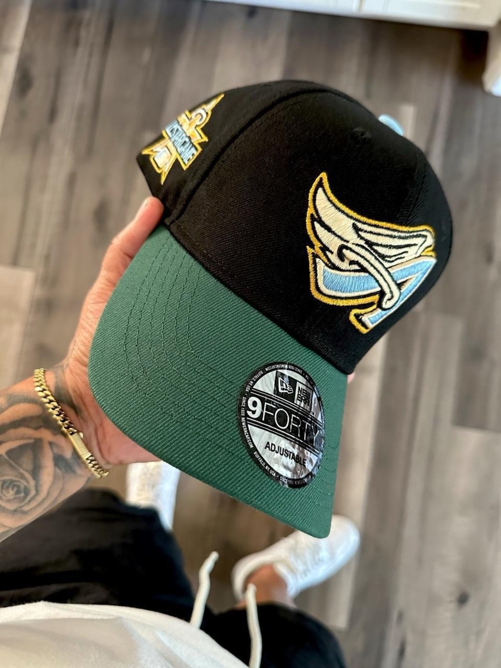 New Era Black Cap with Green Visor and Gold-Trim Patch